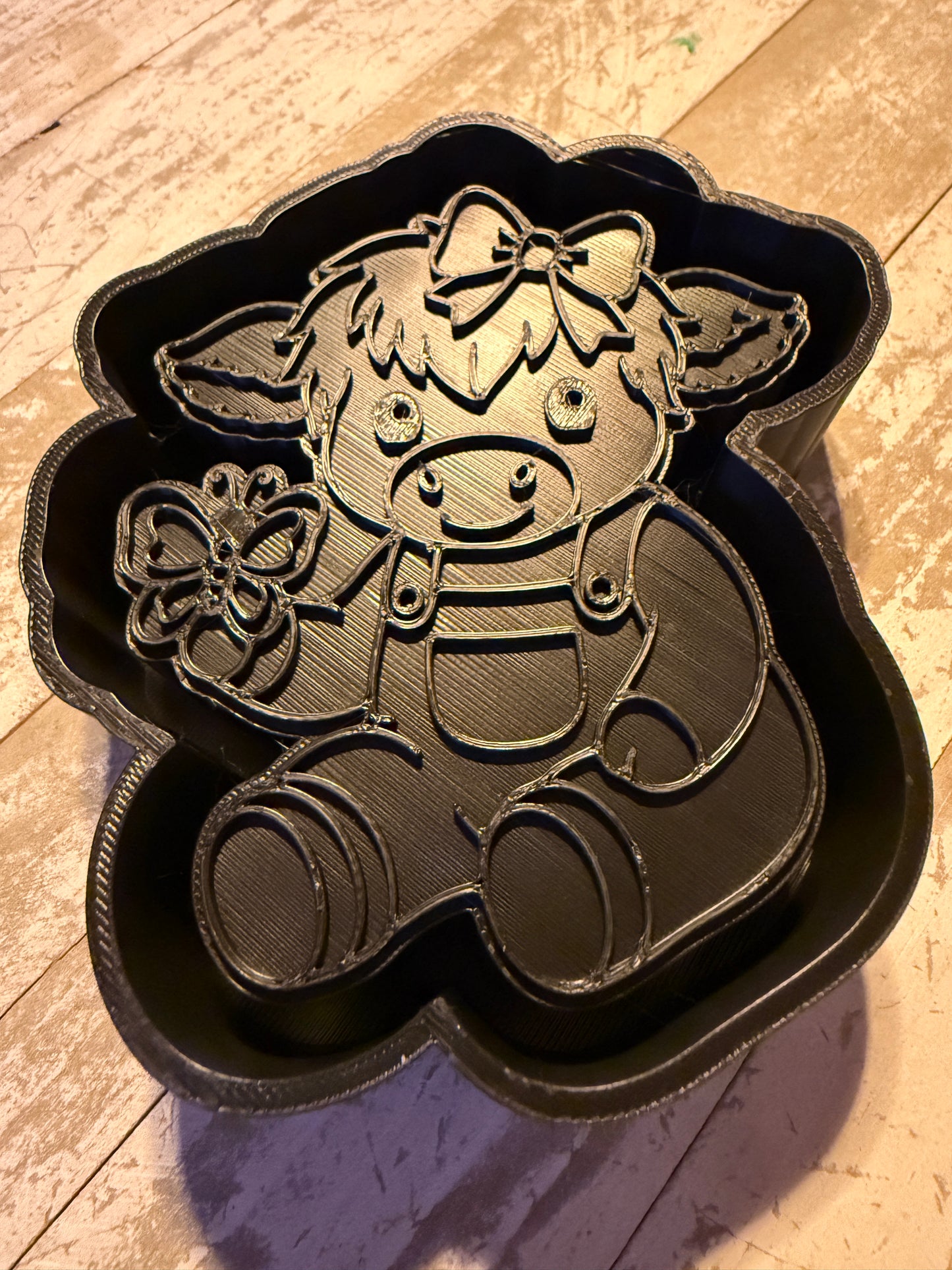 Sitting cow with butterfly mold