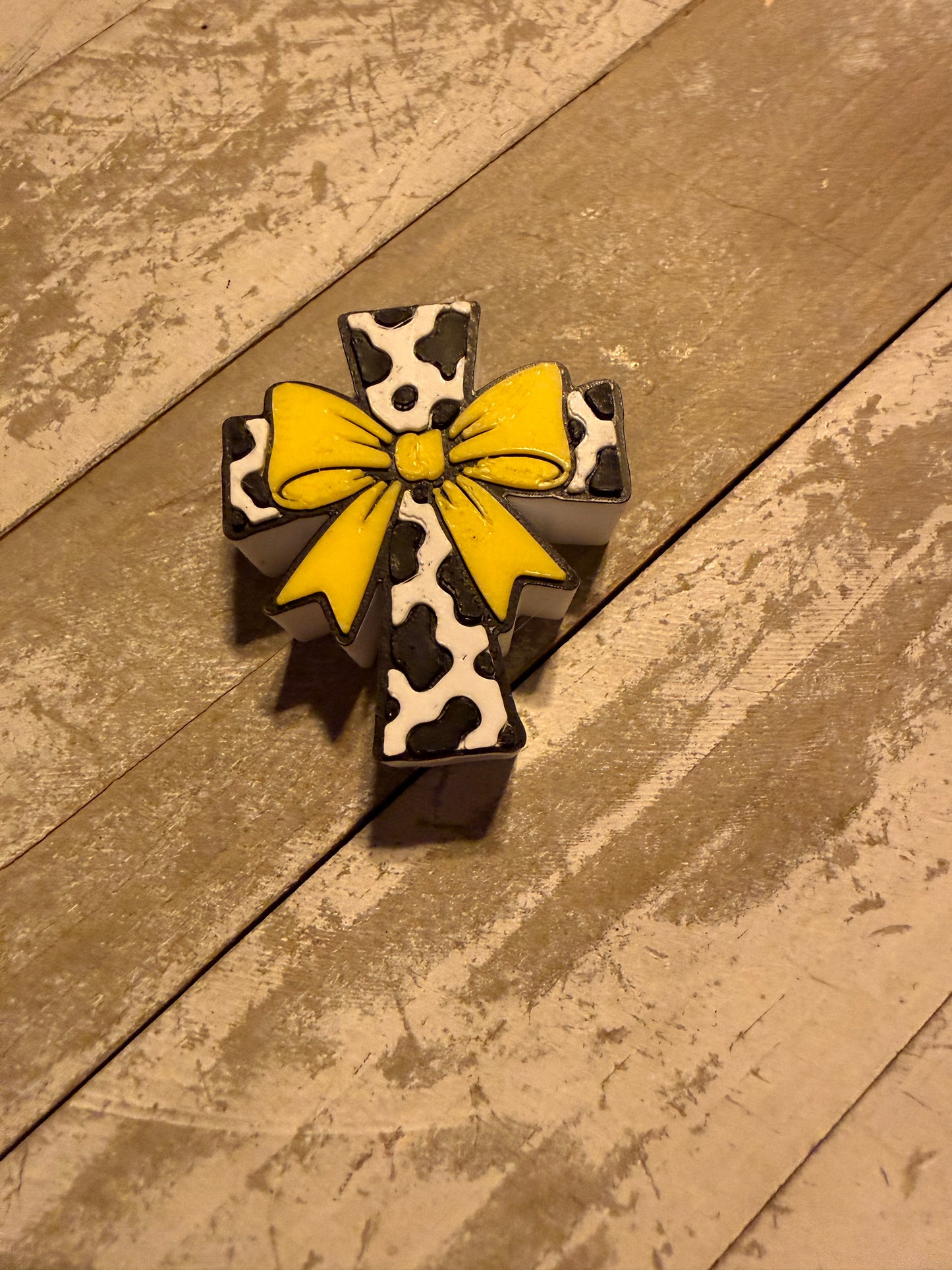Cow print cross with bow straw topper