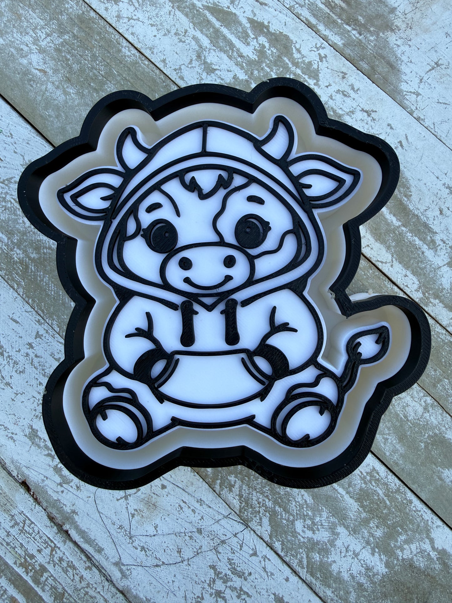 Cow in hoodie mold