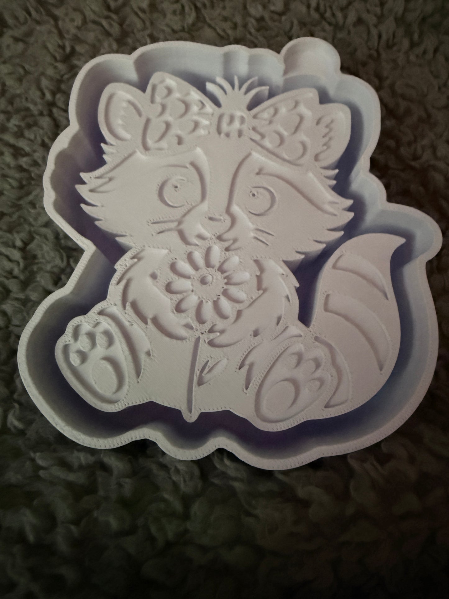 Raccoon with flower mold