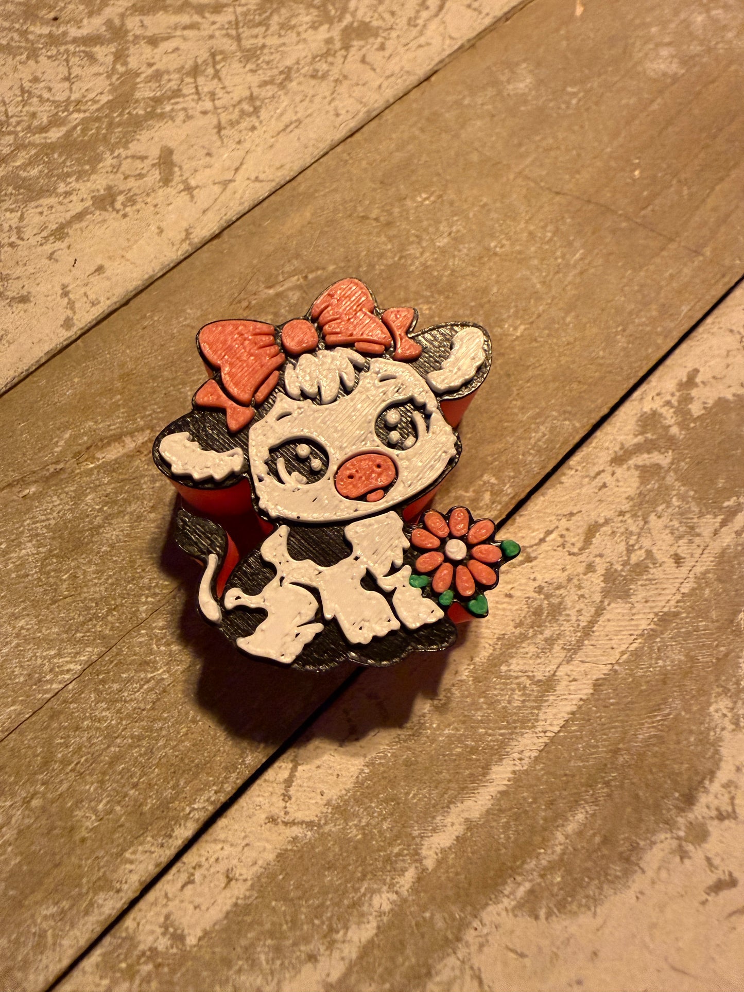 Cow with bow straw topper